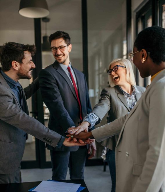 Happy diverse colleagues working united as a team. Business team